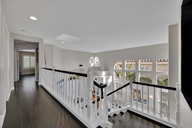 9552 Babauta Rd, San Diego, CA 92129 - corridor with an upstairs landing, a skylight, hardwood / wood-style flooring, and recessed lighting