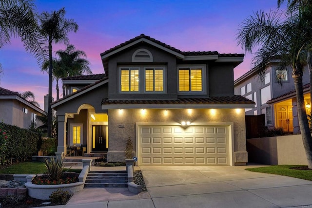 9552 Babauta Rd, San Diego, CA 92129 - view of front of property with a tile roof, stucco siding, a garage, and concrete driveway