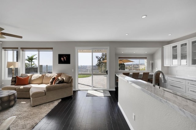 9552 Babauta Rd, San Diego, CA 92129 - living area featuring dark wood-type flooring, ceiling fan, and recessed lighting