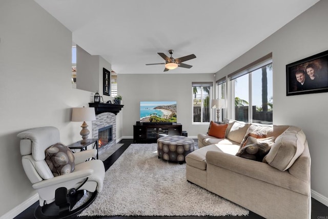 9552 Babauta Rd, San Diego, CA 92129 - living room with a stone fireplace and a ceiling fan