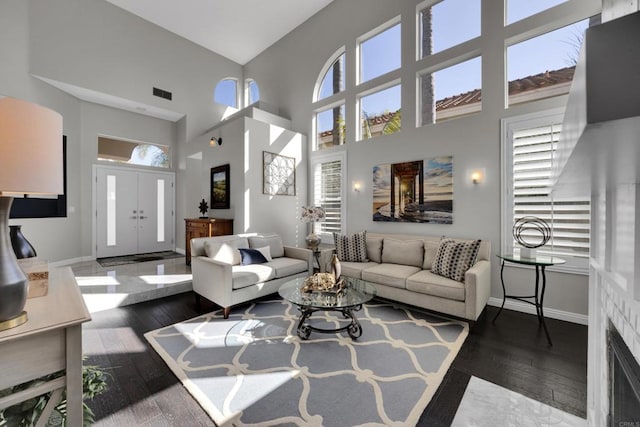 9552 Babauta Rd, San Diego, CA 92129 - living area featuring plenty of natural light, a towering ceiling, and wood-type flooring