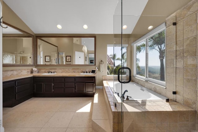 9552 Babauta Rd, San Diego, CA 92129 - full bathroom featuring double vanity, a garden tub, recessed lighting, backsplash, and tile patterned flooring