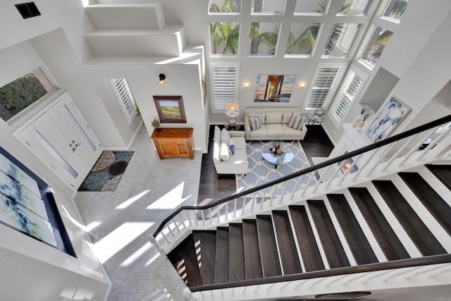 9552 Babauta Rd, San Diego, CA 92129 - living room featuring a high ceiling and stairway