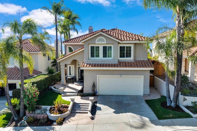 9552 Babauta Rd, San Diego, CA 92129 - mediterranean / spanish house featuring a tile roof, an attached garage, stucco siding, and driveway