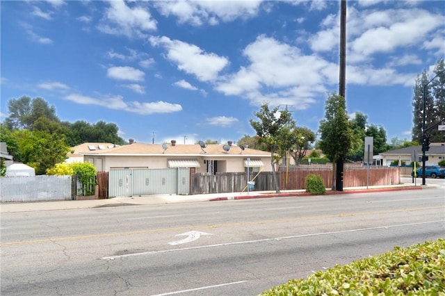 1026 Walnut Grove Ave, Rosemead, CA 91770 - view of front facade with a fenced front yard, a gate, and stucco siding