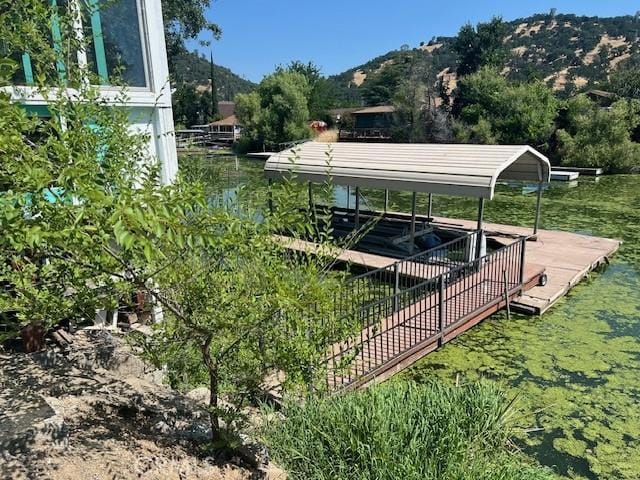 13238 Ebbtide, Clearlake Oaks, CA 95423 - view of community with a mountain view, a detached carport, and a boat dock