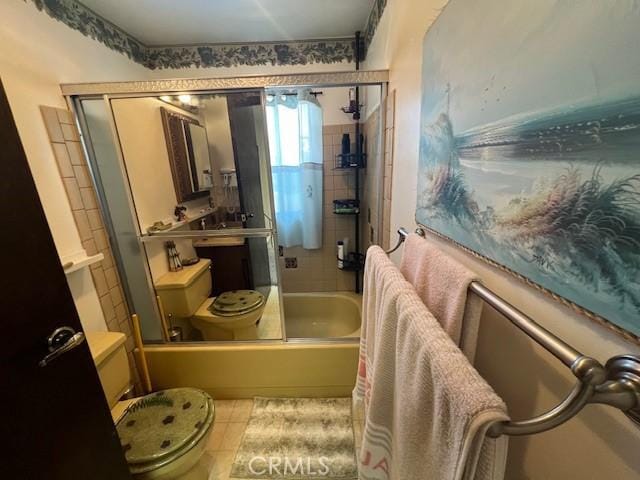 13238 Ebbtide, Clearlake Oaks, CA 95423 - bathroom featuring bath / shower combo with glass door, toilet, and tile patterned flooring