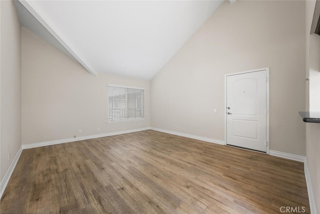 2925 E Spaulding St Unit 304, Long Beach, CA 90804 - unfurnished living room featuring wood finished floors and high vaulted ceiling