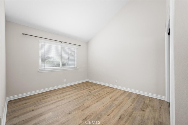 2925 E Spaulding St Unit 304, Long Beach, CA 90804 - unfurnished room featuring light wood-style flooring and vaulted ceiling