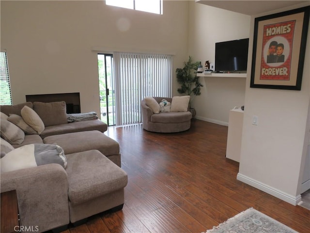 5744 E Creekside Ave Unit 10, Orange, CA 92869 - living room with baseboards, hardwood / wood-style flooring, and a high ceiling