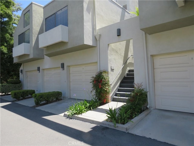 5744 E Creekside Ave Unit 10, Orange, CA 92869 - view of home's exterior featuring stucco siding and a garage