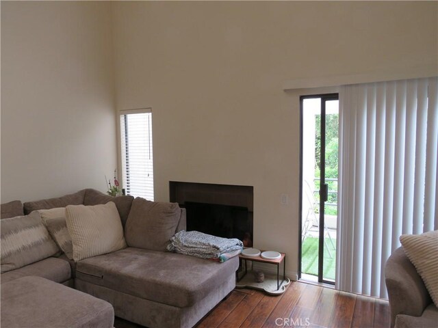 5744 E Creekside Ave Unit 10, Orange, CA 92869 - living area with wood finished floors, a fireplace, and baseboards