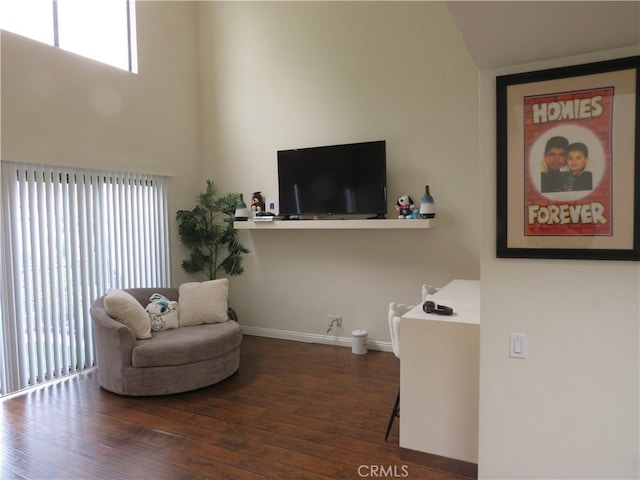 5744 E Creekside Ave Unit 10, Orange, CA 92869 - sitting room with wood finished floors and baseboards