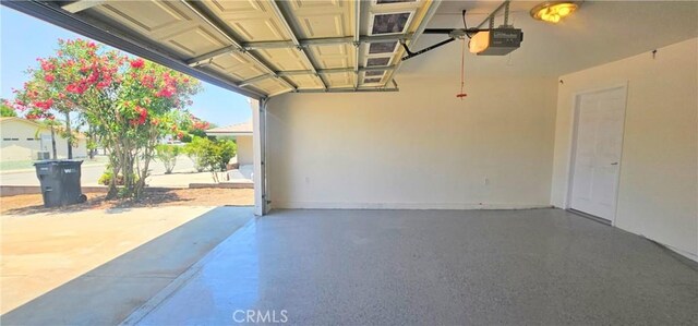 25687 Sandy Lodge Rd, Menifee, CA 92586 - garage featuring a garage door opener