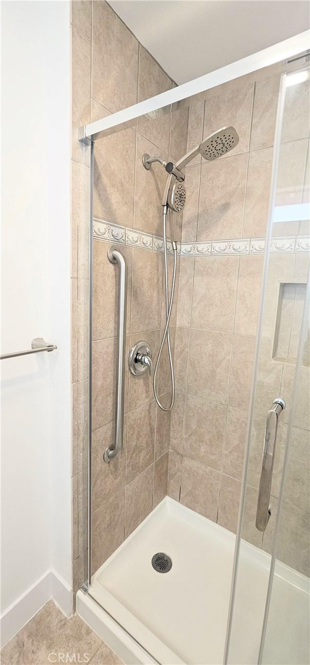 25687 Sandy Lodge Rd, Menifee, CA 92586 - full bathroom featuring a stall shower and tile patterned floors