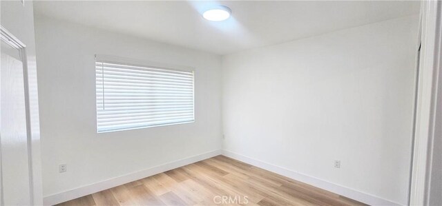25687 Sandy Lodge Rd, Menifee, CA 92586 - unfurnished bedroom with light wood-style flooring and baseboards