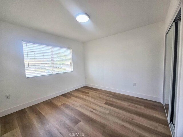 25687 Sandy Lodge Rd, Menifee, CA 92586 - spare room featuring baseboards and wood finished floors
