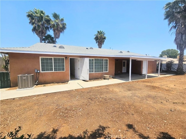 25687 Sandy Lodge Rd, Menifee, CA 92586 - back of house with central AC, stucco siding, and a patio
