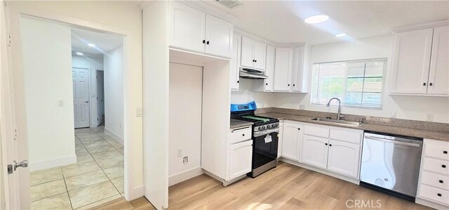 25687 Sandy Lodge Rd, Menifee, CA 92586 - kitchen with appliances with stainless steel finishes, a sink, under cabinet range hood, white cabinetry, and baseboards
