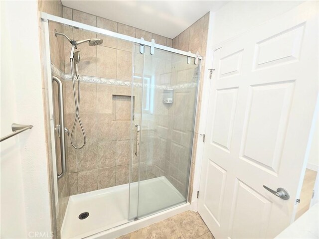 25687 Sandy Lodge Rd, Menifee, CA 92586 - bathroom featuring a stall shower and tile patterned floors