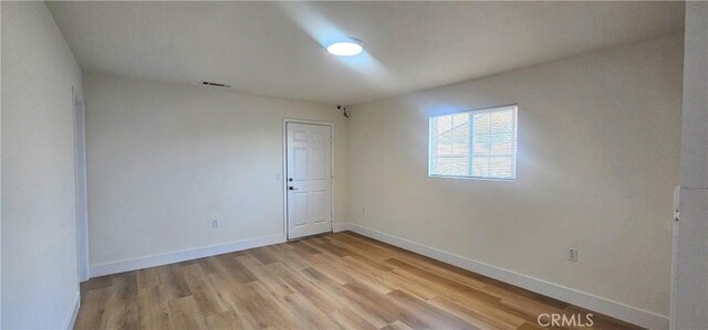 25687 Sandy Lodge Rd, Menifee, CA 92586 - empty room with light wood-type flooring and baseboards