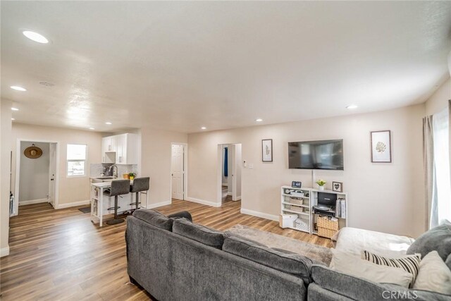 414 Iowa Ave, Riverside, CA 92507 - living area featuring recessed lighting and light wood-style flooring
