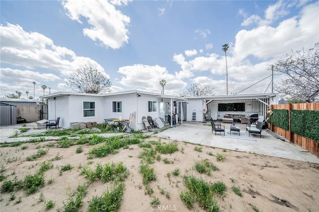 414 Iowa Ave, Riverside, CA 92507 - back of house with a patio area, a fenced backyard, stucco siding, and an outdoor hangout area