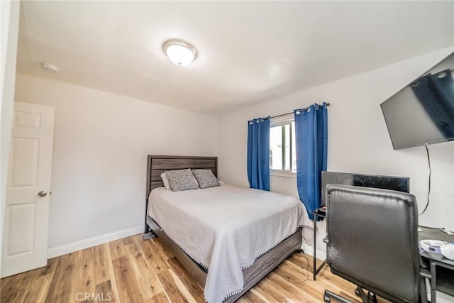 414 Iowa Ave, Riverside, CA 92507 - bedroom with light wood-type flooring and baseboards