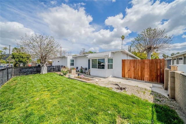414 Iowa Ave, Riverside, CA 92507 - rear view of house featuring a fenced backyard and a patio area