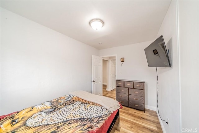 414 Iowa Ave, Riverside, CA 92507 - bedroom with light wood-style floors and baseboards