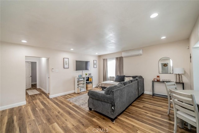 414 Iowa Ave, Riverside, CA 92507 - living room featuring a wall unit AC, wood finished floors, and recessed lighting