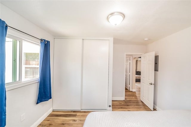414 Iowa Ave, Riverside, CA 92507 - unfurnished bedroom featuring wood finished floors and a closet
