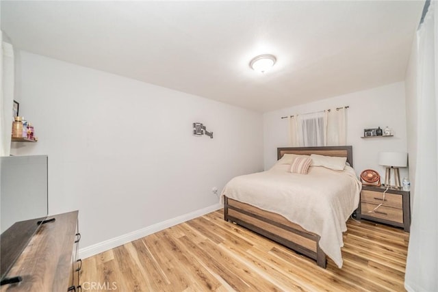 414 Iowa Ave, Riverside, CA 92507 - bedroom with light wood-type flooring and baseboards
