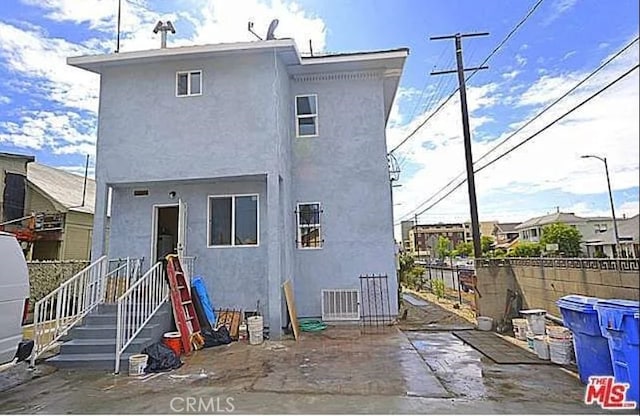 5102 Woodlawn Ave, Los Angeles, CA 90011 - rear view of property with stucco siding