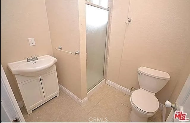 5102 Woodlawn Ave, Los Angeles, CA 90011 - full bathroom with a shower stall, vanity, and tile patterned floors