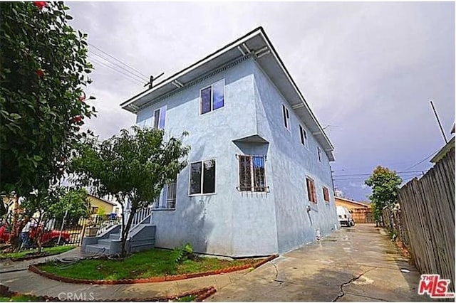 5102 Woodlawn Ave, Los Angeles, CA 90011 - view of home's exterior with stucco siding