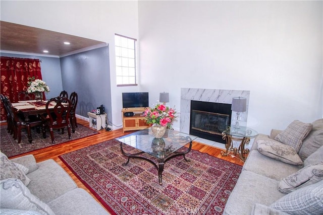 27126 Majello Ct, Temecula, CA 92591 - living area featuring wood finished floors, a high end fireplace, and a towering ceiling