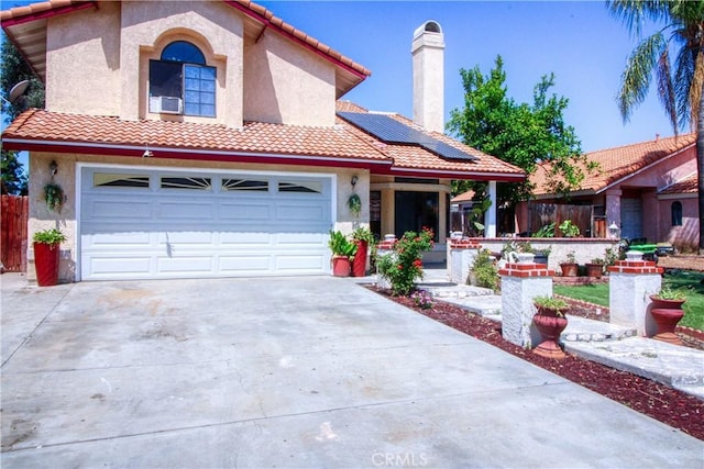 27126 Majello Ct, Temecula, CA 92591 - view of front of home featuring driveway, roof mounted solar panels, a tile roof, a garage, and stucco siding