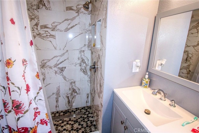 27126 Majello Ct, Temecula, CA 92591 - bathroom featuring tiled shower and vanity