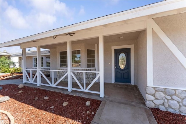 18346 Hackberry St, Hesperia, CA 92345 - property entrance with stucco siding and a porch