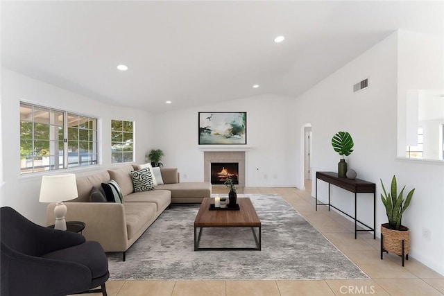 18346 Hackberry St, Hesperia, CA 92345 - living room with healthy amount of natural light, vaulted ceiling, recessed lighting, light tile patterned floors, and a fireplace