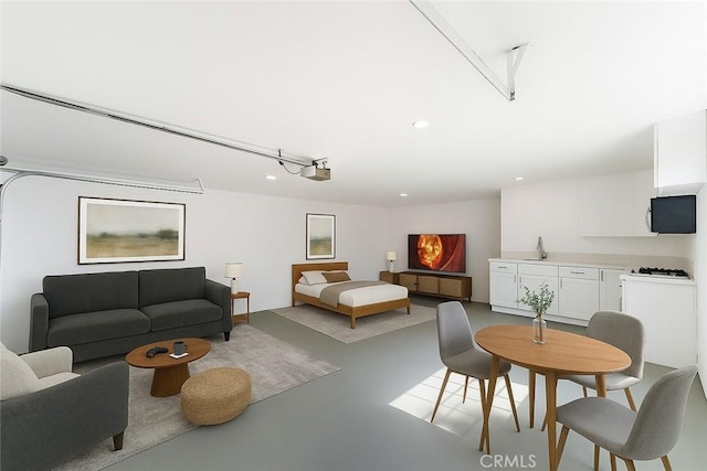18346 Hackberry St, Hesperia, CA 92345 - living room featuring finished concrete flooring and recessed lighting