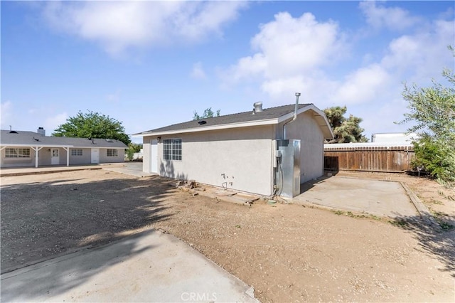 18346 Hackberry St, Hesperia, CA 92345 - rear view of property with stucco siding and a patio area