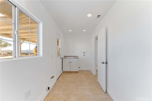 18346 Hackberry St, Hesperia, CA 92345 - hallway featuring a sink, recessed lighting, light tile patterned floors, and baseboards