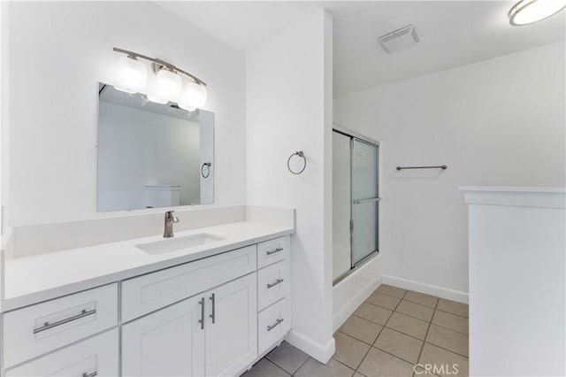 18346 Hackberry St, Hesperia, CA 92345 - full bathroom with vanity, tile patterned floors, combined bath / shower with glass door, and baseboards