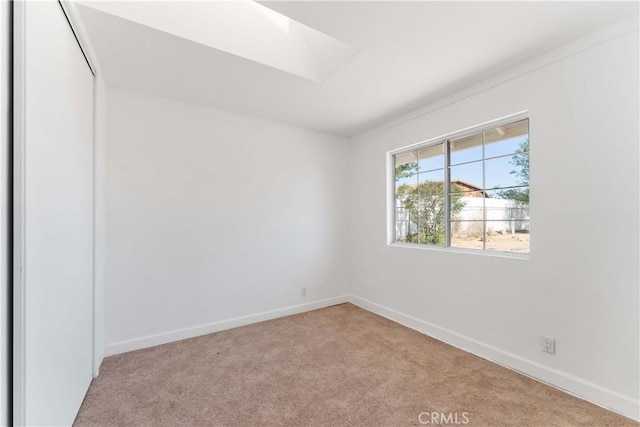 18346 Hackberry St, Hesperia, CA 92345 - spare room featuring carpet floors, a skylight, and baseboards