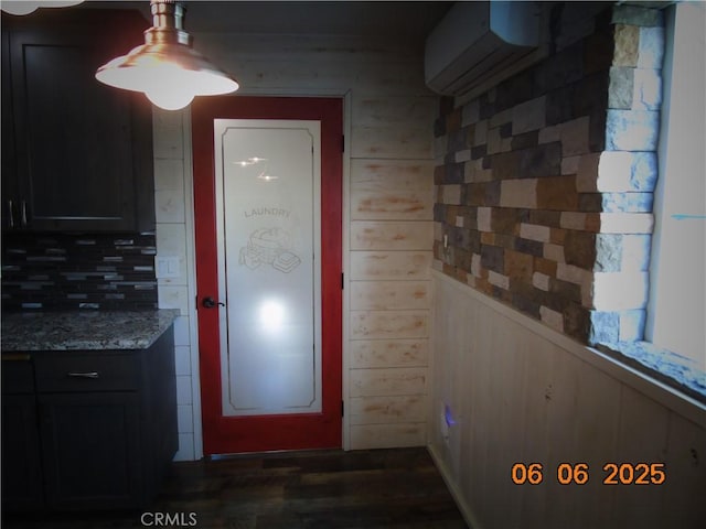 635 5th St, Willows, CA 95988 - doorway featuring dark wood-style floors and wooden walls