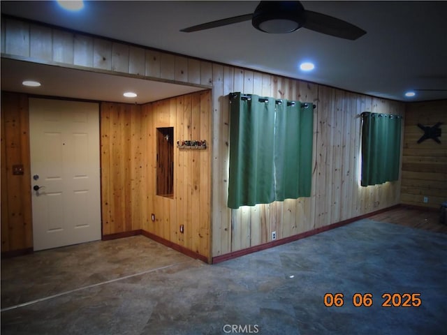 635 5th St, Willows, CA 95988 - spare room with wooden walls, a ceiling fan, recessed lighting, and concrete flooring
