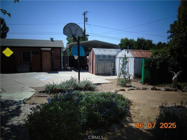 635 5th St, Willows, CA 95988 - view of yard with a storage shed, a detached carport, and concrete driveway
