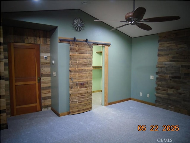 635 5th St, Willows, CA 95988 - carpeted empty room with a barn door, ceiling fan, and lofted ceiling
